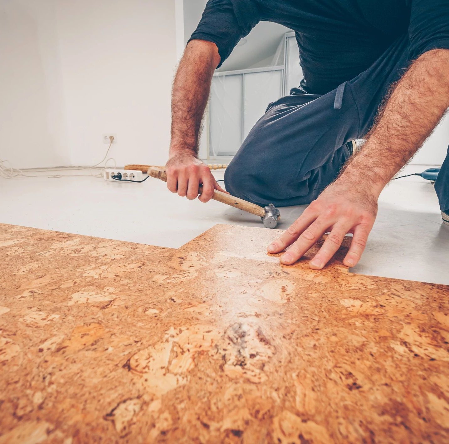 person installing cork flooring from Carpet Depot Inc in the North Hollywood, CA area