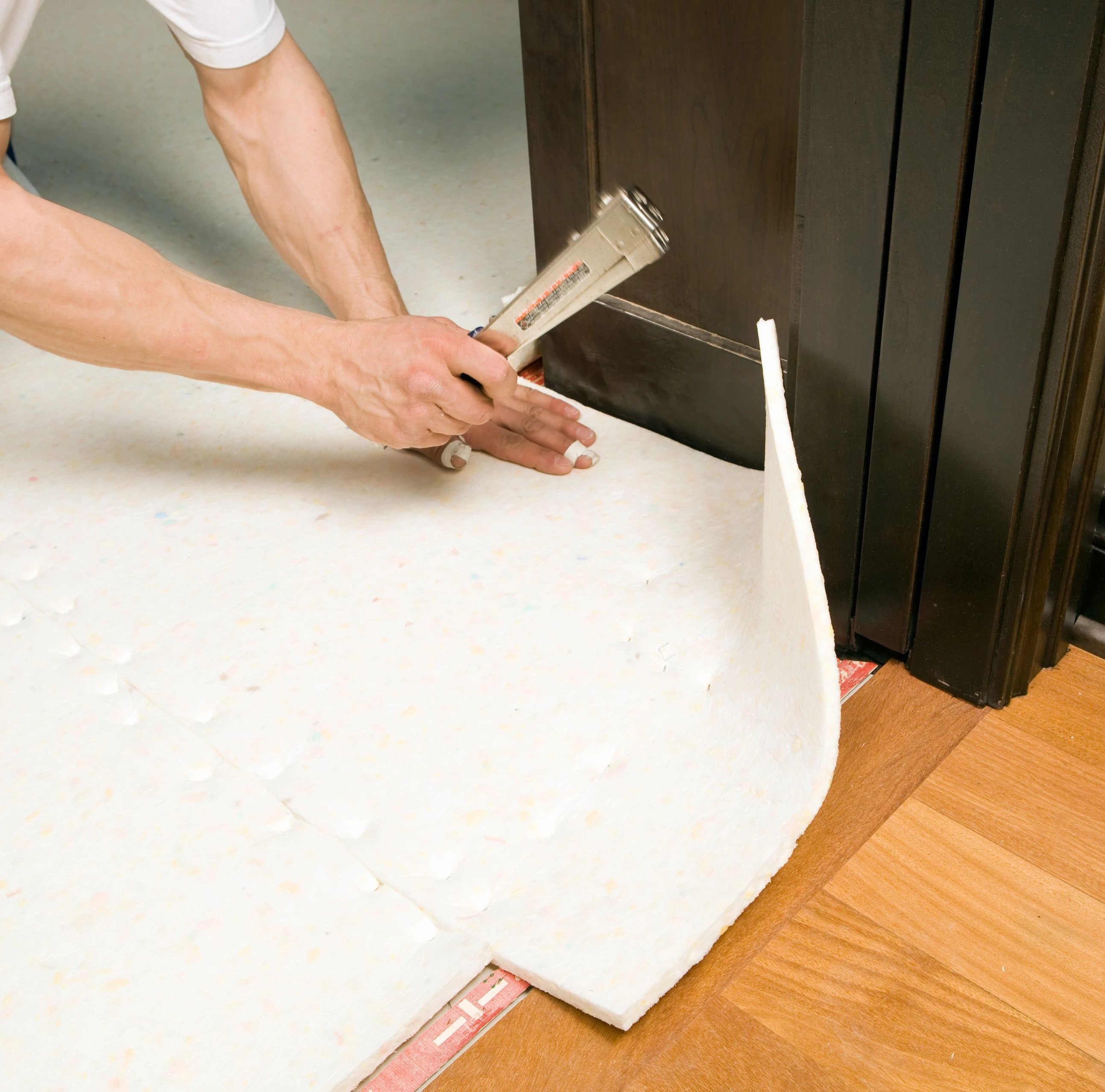 person installing flooring underlayment from Carpet Depot Inc in the North Hollywood, CA area